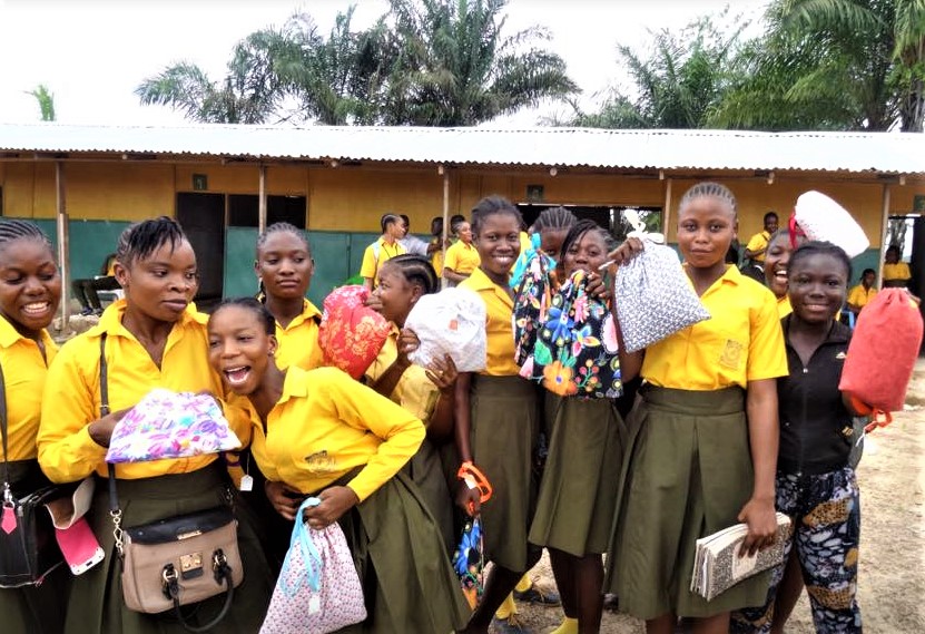 a group of young women in yellow uniforms with period kits